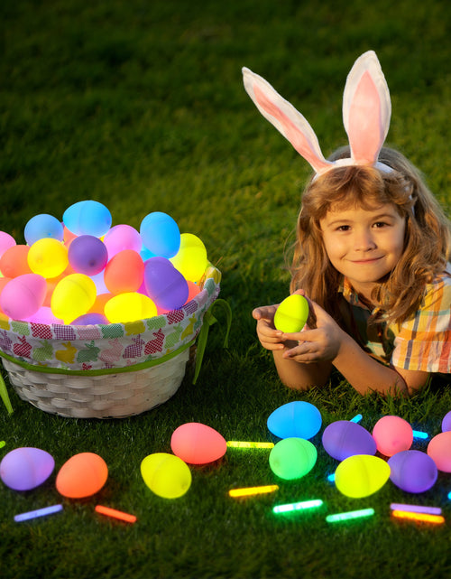Load image into Gallery viewer, 70 Pcs Easter Eggs Filled with Toys (35 Eggs &amp; 35 Sticks),Easter Glowing Eggs Set for Kids,Easter Basket Stuffers Fillers Gift,Easter Eggs Hunt Game Party Favors
